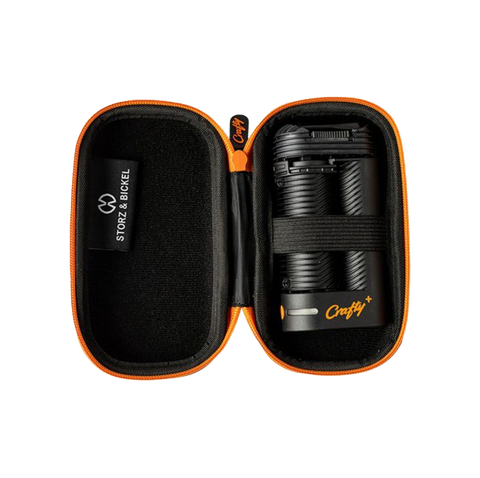 Storz and Bickel Crafty+ case with device. Black color with orange accents.