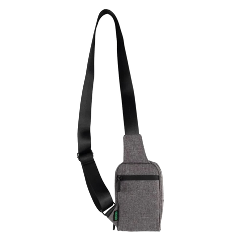 Image showing the back of the grey Ooze Traveler Cross body smell proof bag. Grey color pouch with black straps. 