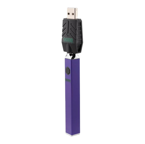 Ooze Quad 510 vape device in Purple with attached black USB charger.